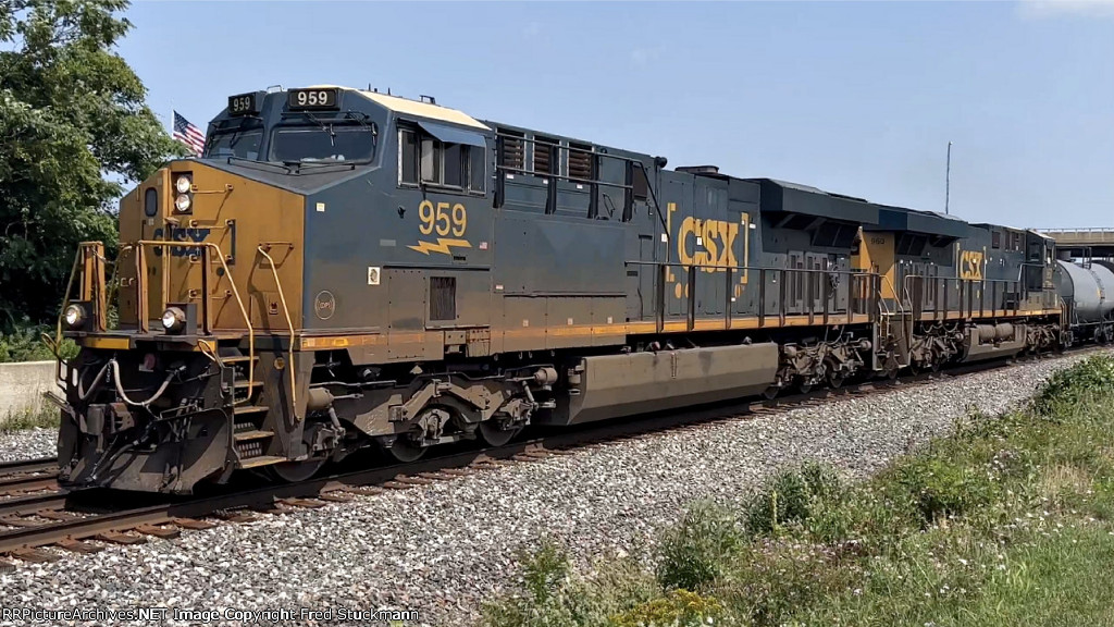 CSX 959 leads another M369.